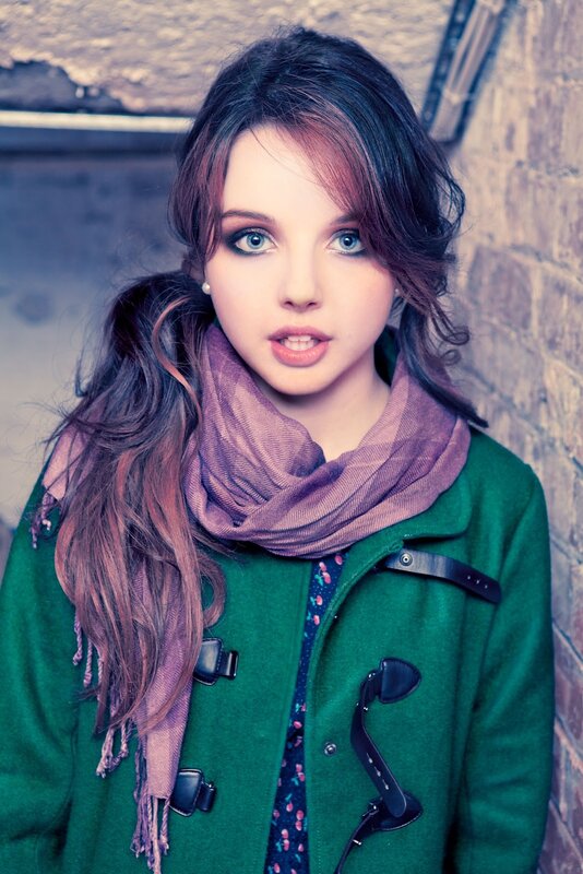 woman in green coat with scarf