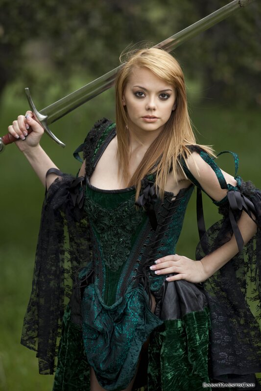 woman in green corset with sword
