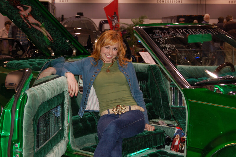 Woman in green custom car