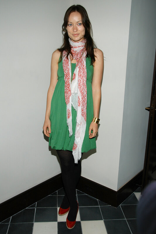 Woman in green dress and scarf