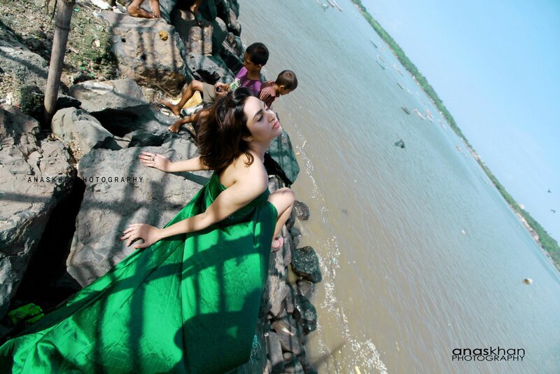 Woman in green dress by the river