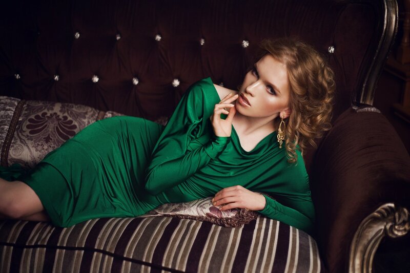 Woman in Green Dress — Dramatic, Photograph, Couch, Pillow