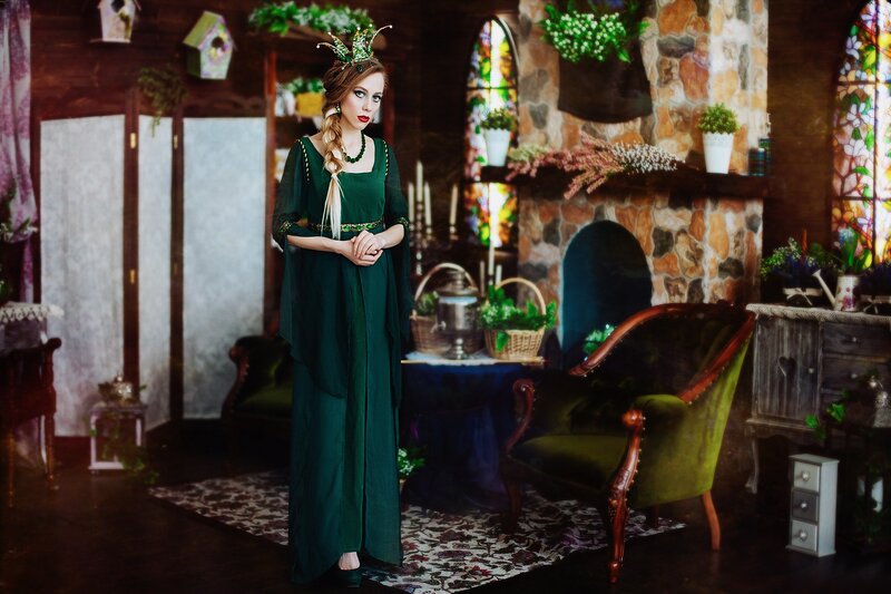 Woman in Green Dress — Dramatic, Photograph, Fireplace