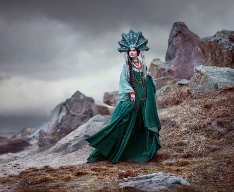 Woman in Green Dress — Dramatic, Photograph, Rocks