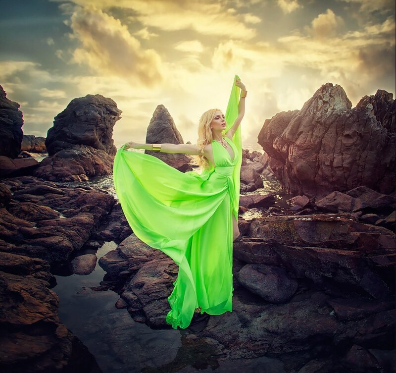 Woman in Green Dress — Dramatic, Sunset, Photograph, Rocks