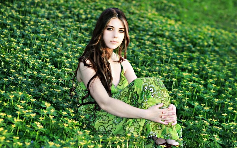 woman in green dress in field