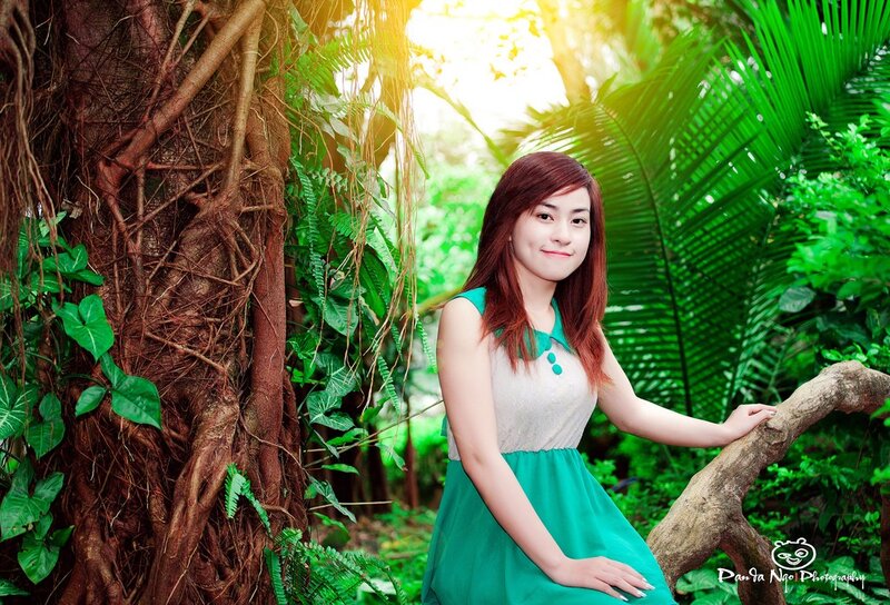 woman in green dress in forest
