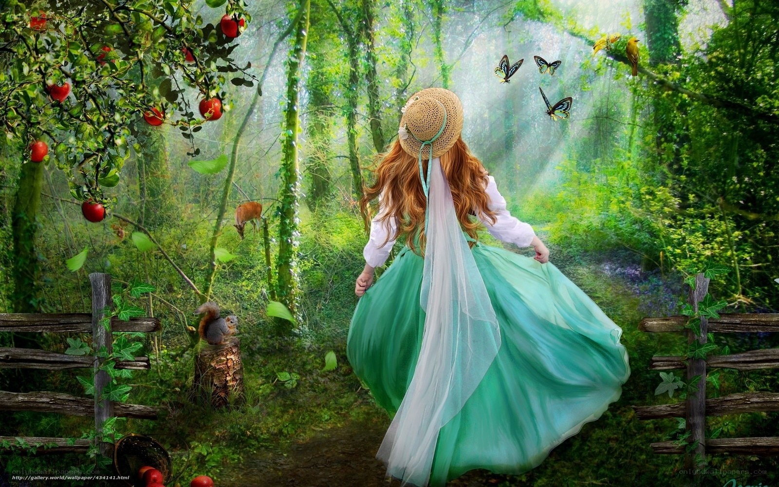 Woman in green dress in forest