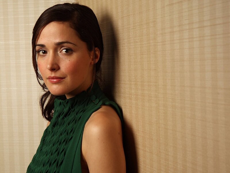 woman in green dress leaning