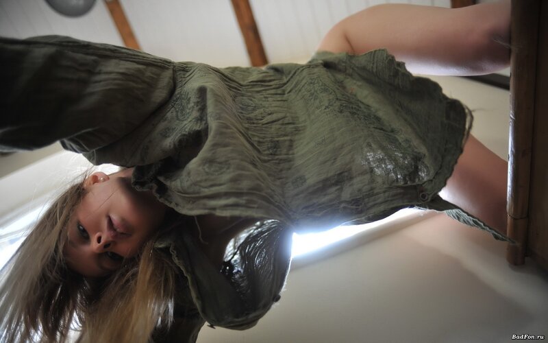 woman in green dress lying down