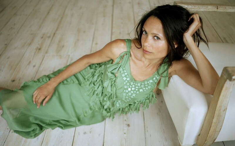 woman in green dress lying down