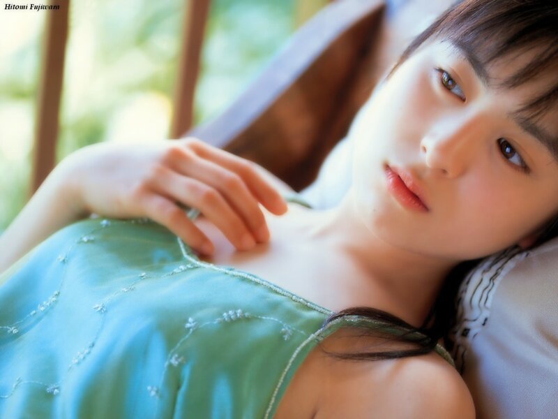 Woman in green dress lying down