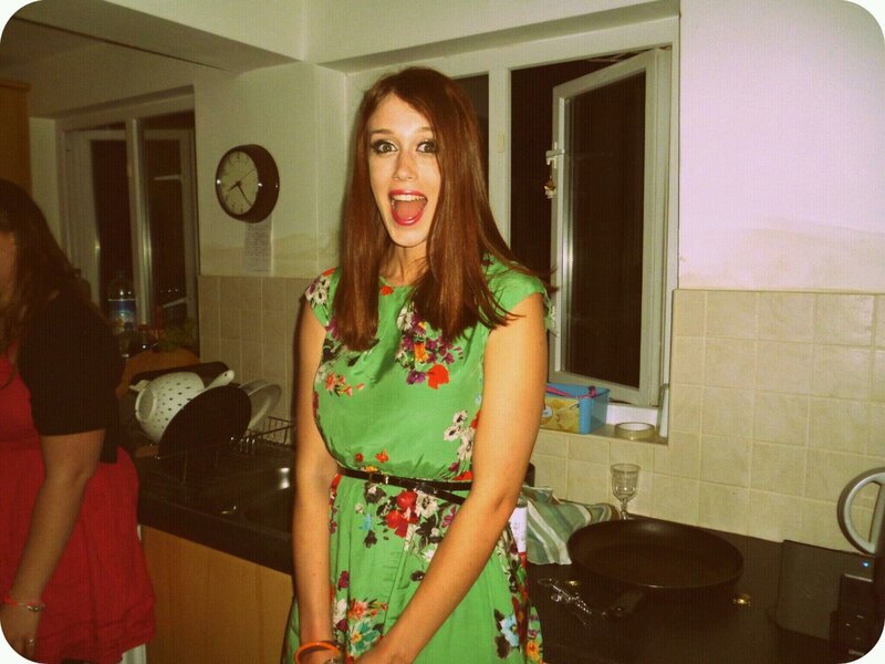 Woman in green dress making face