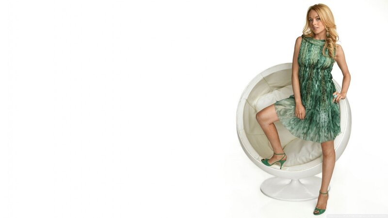 woman in green dress on chair