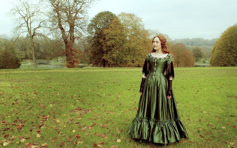 Woman in green dress on lawn