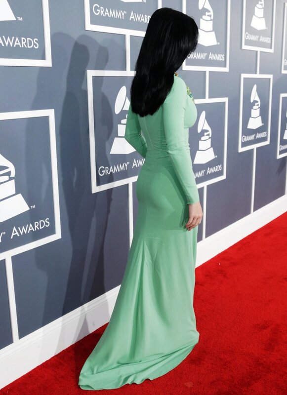 Woman in green dress on red carpet