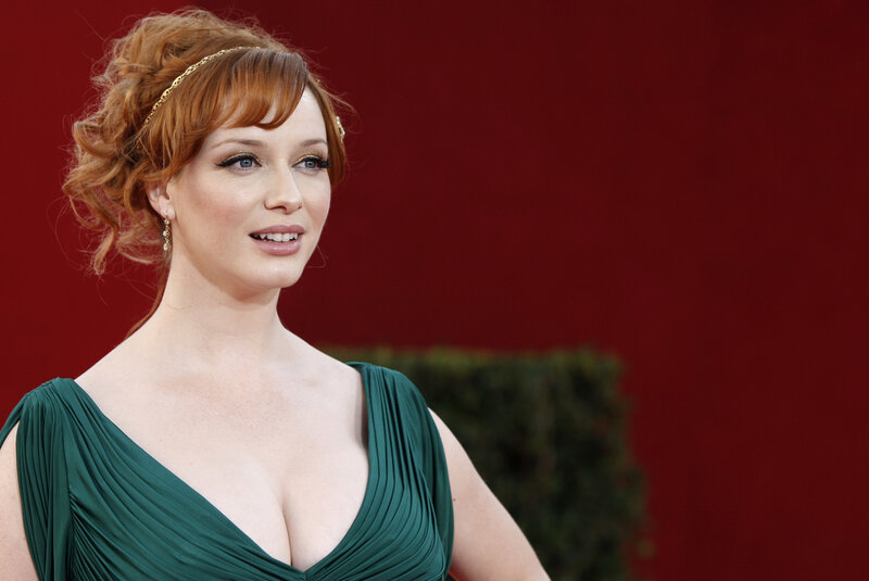 Woman in green dress on red carpet
