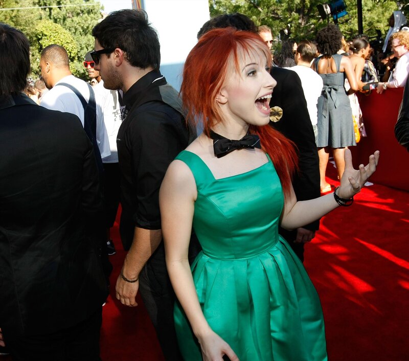 Woman in green dress on red carpet