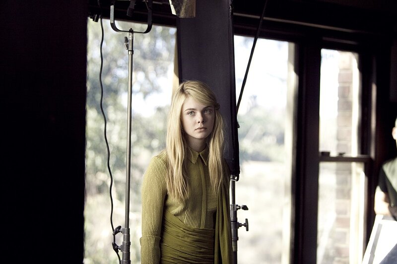 woman in green dress on set