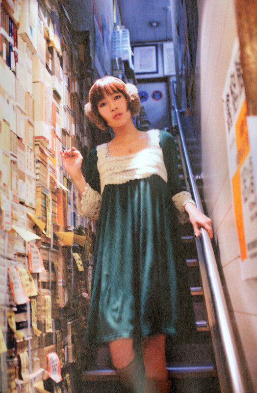 woman in green dress on stairs