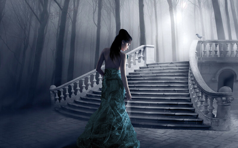 woman in green dress on stairs