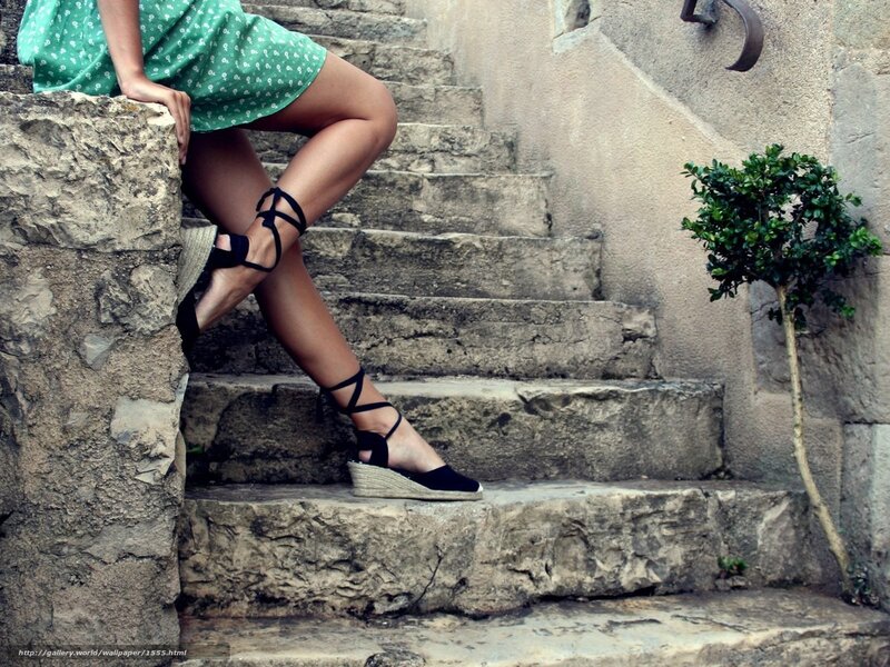 woman in green dress on stone steps