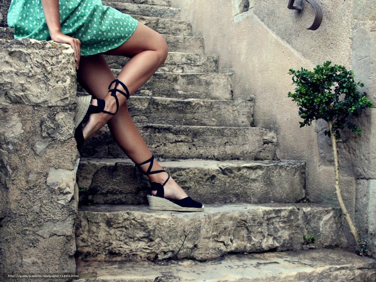 woman in green dress on stone steps