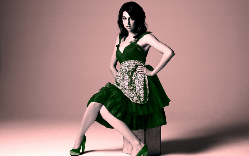 woman in green dress posing