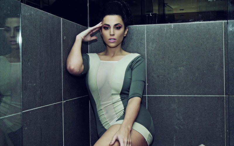 woman in green dress posing