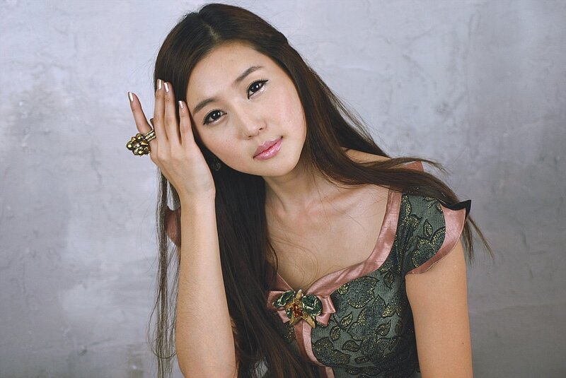 woman in green dress posing