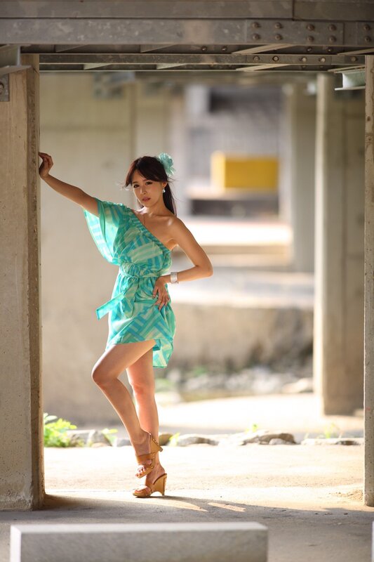 woman in green dress posing