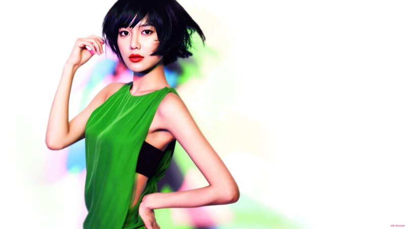 woman in green dress posing