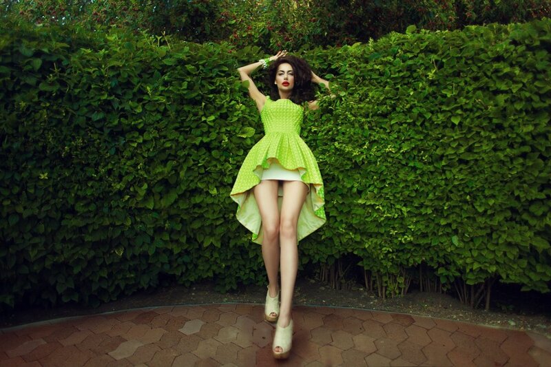 Woman in green dress posing