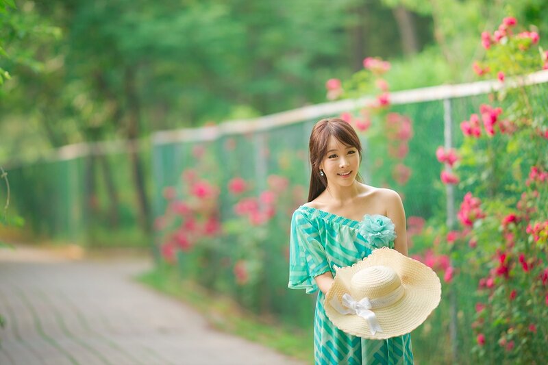 Woman in Green Dress — Serene, Spring, Photograph, Hat