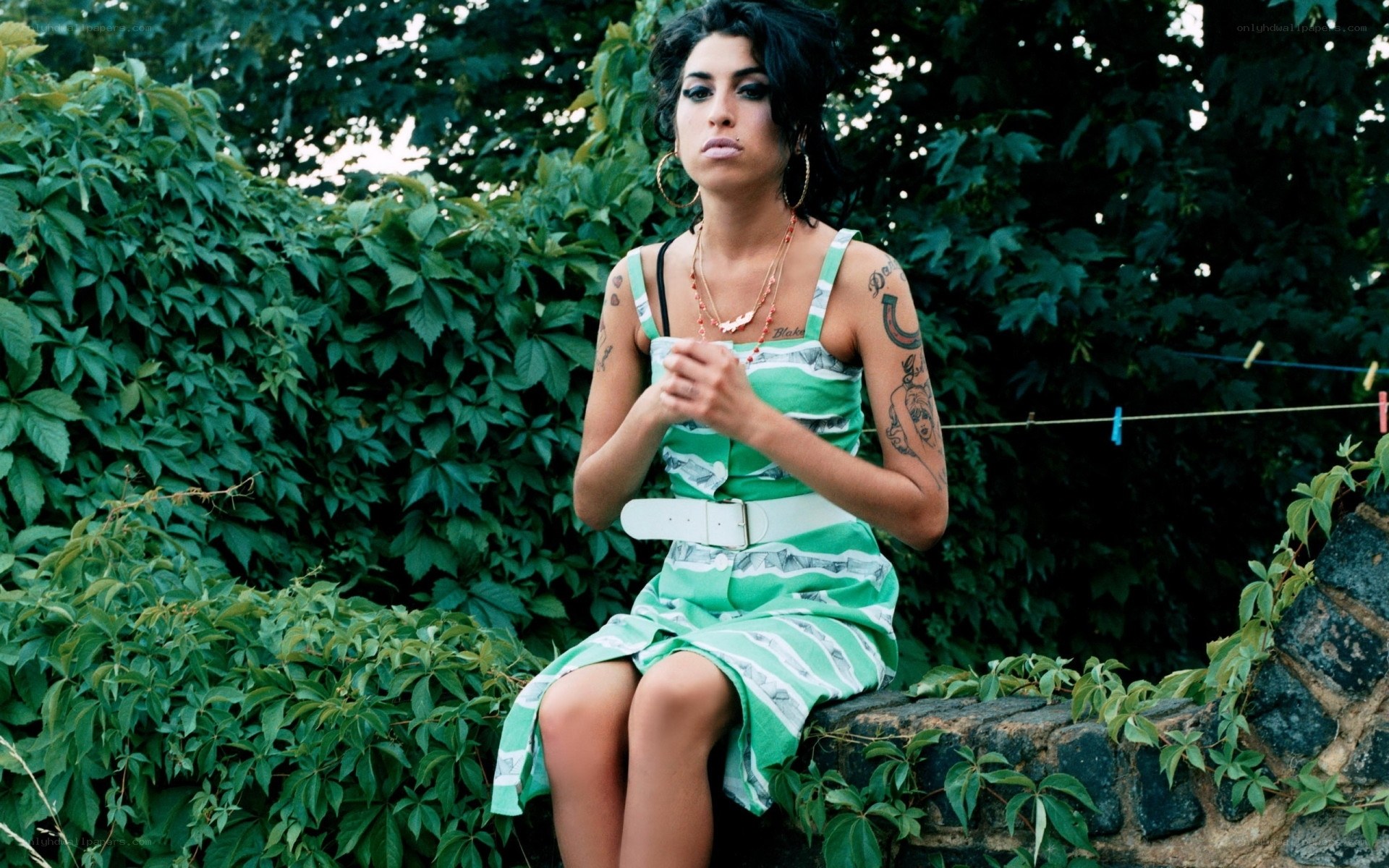 woman in green dress sitting outside
