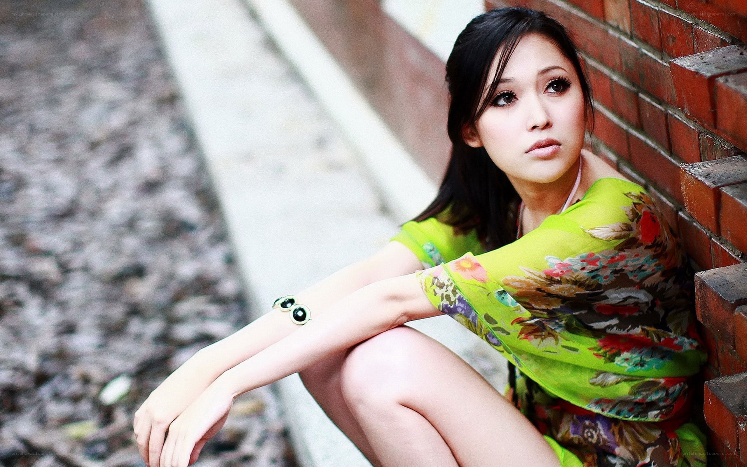 woman in green dress sitting