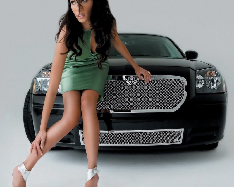 woman in green dress with car