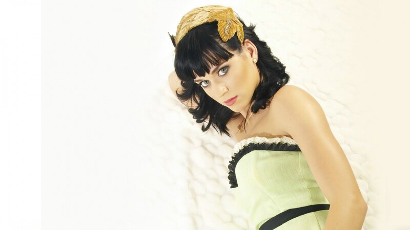 woman in green dress with headband