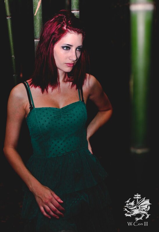 woman in green dress with red hair