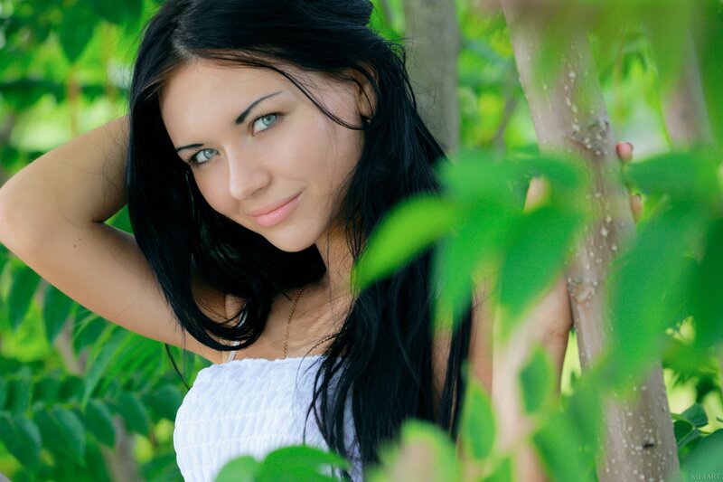 woman in green foliage