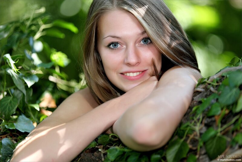 woman in green foliage
