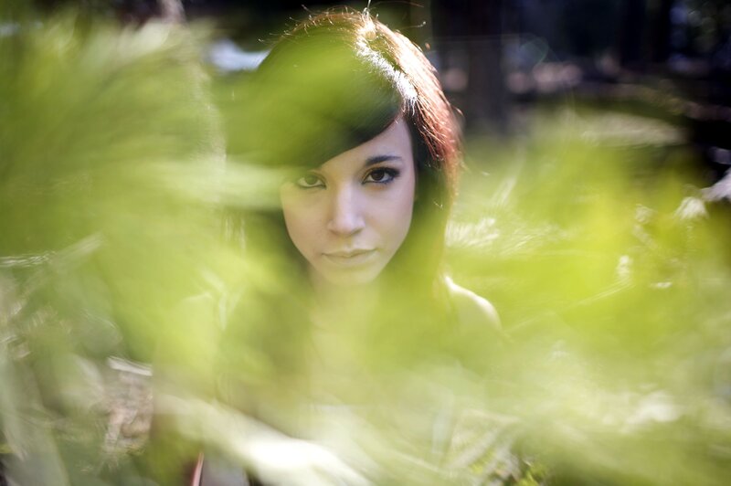 woman in green foliage