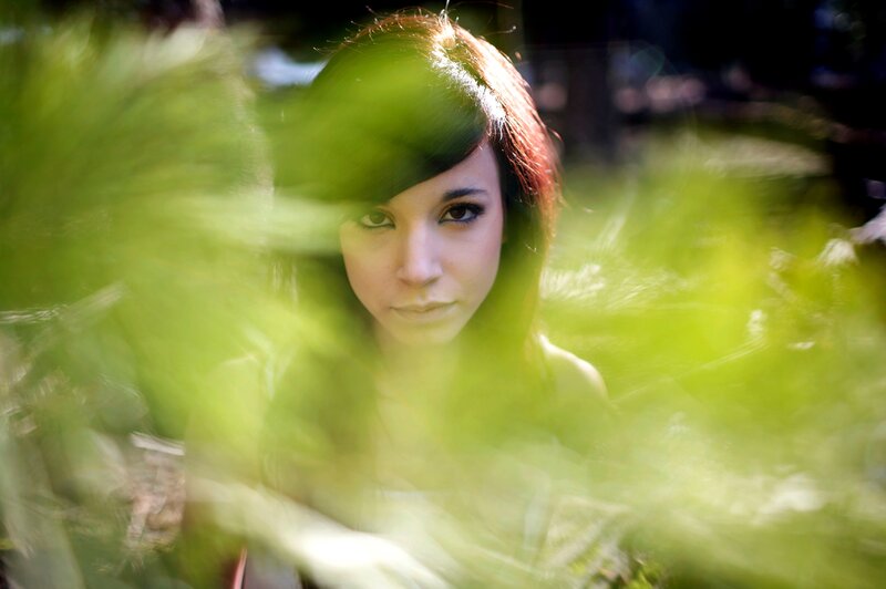 woman in green foliage