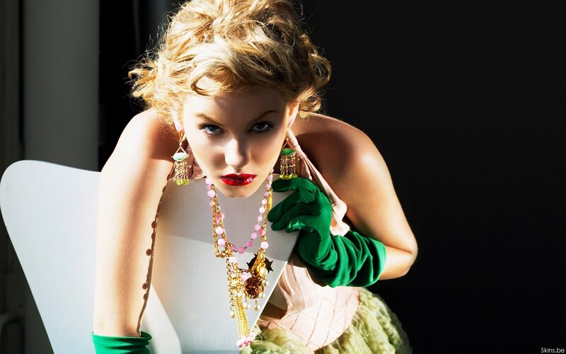 woman in green gloves and jewelry