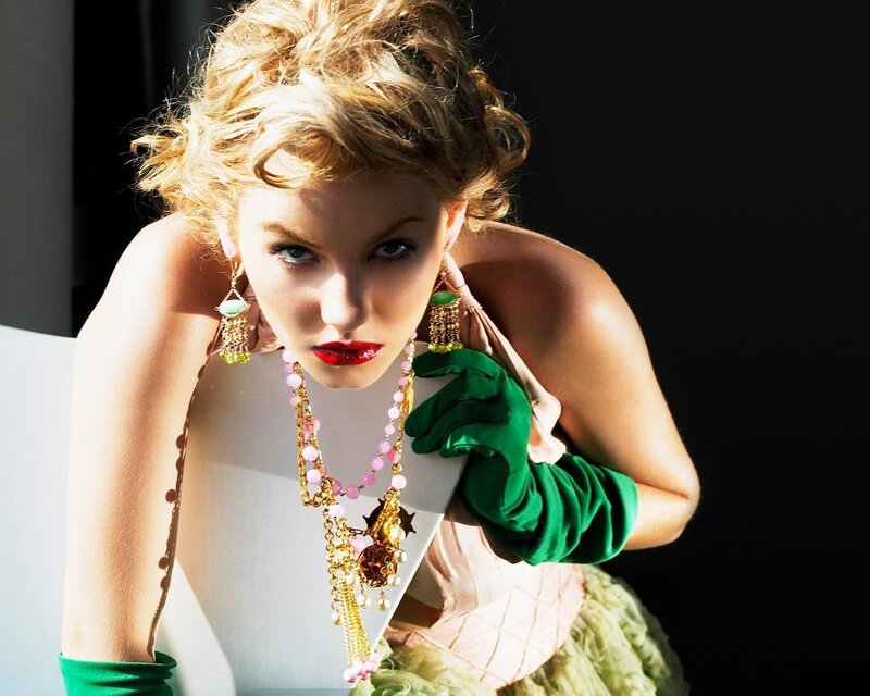 woman in green gloves and jewelry