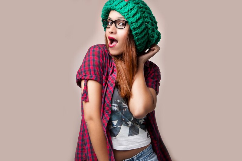 woman in green hat and glasses