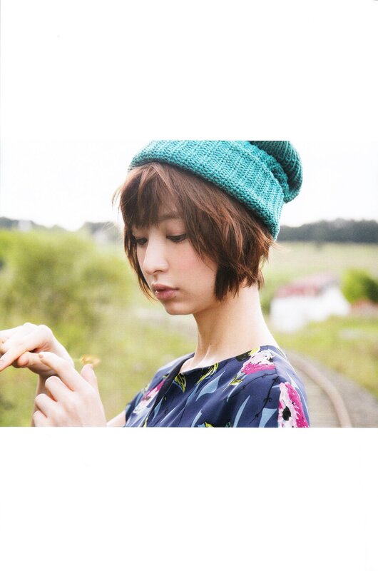 woman in green hat outdoors