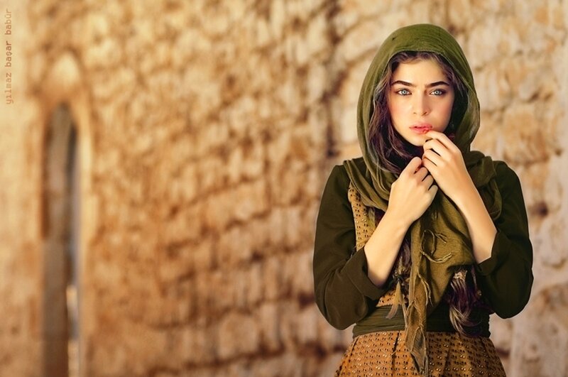 woman in green headscarf