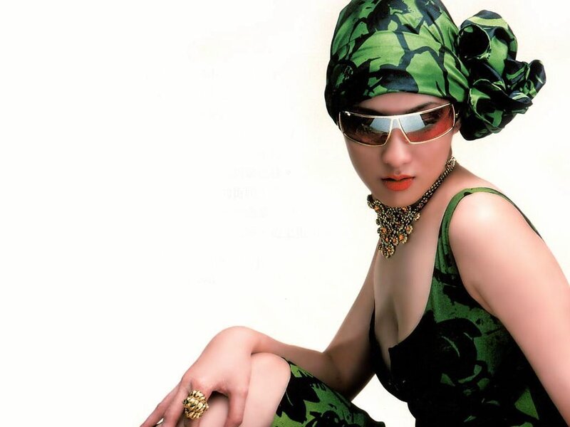 woman in green headwrap and sunglasses