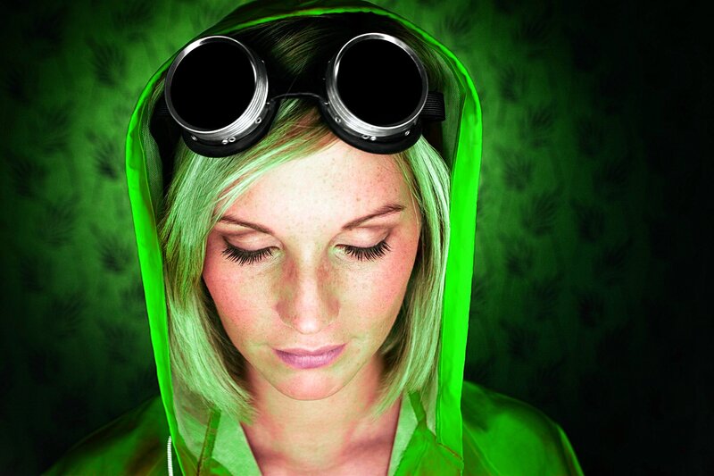 woman in green hood with goggles